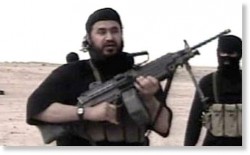 Abu-Musab-bin-taking-kickbacks-from-the-CIA-Zarqawi, in a desert somewhere...with a gun.